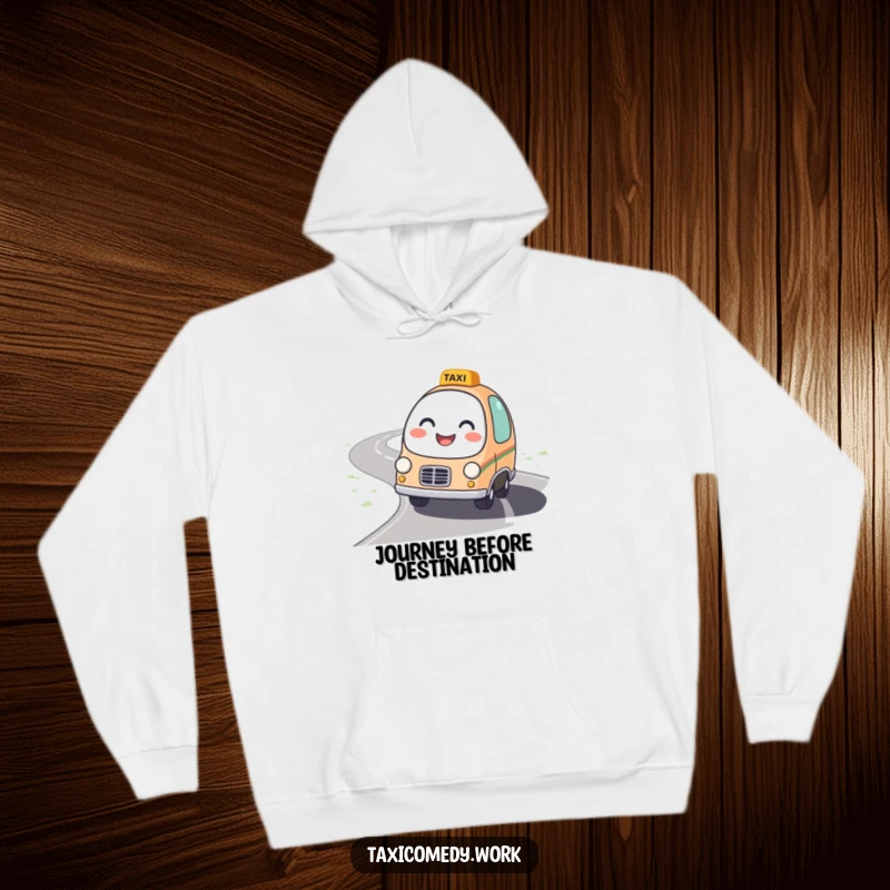 Funny Taxi Hoodie featuring a round, friendly taxi character with a bright smile driving on a winding road, perfect for cozy wear.